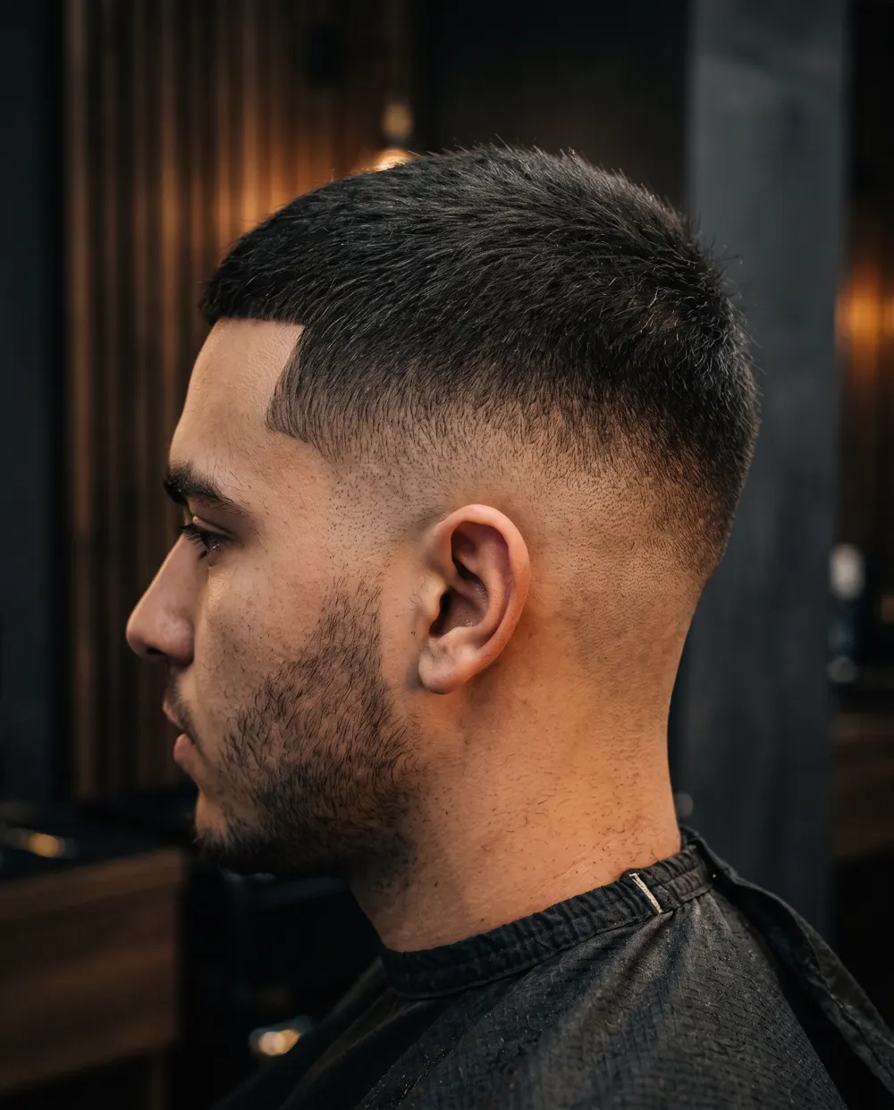 Low skin fade with a crisp temple line